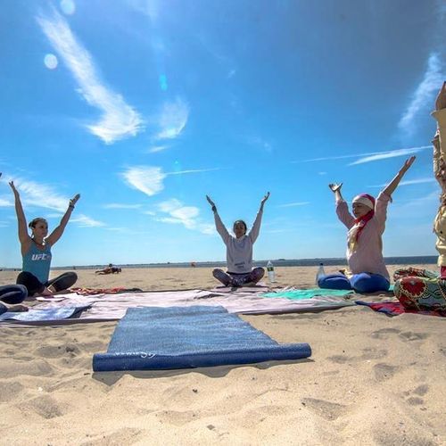 Teaching yoga on the beach.