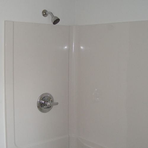 bathroom tub with shower surround install in a hou