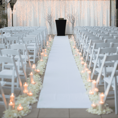 Backdrop with lighting, runner, petals and candles