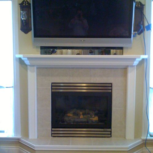 Installed new tile and a wood mantel that supporte