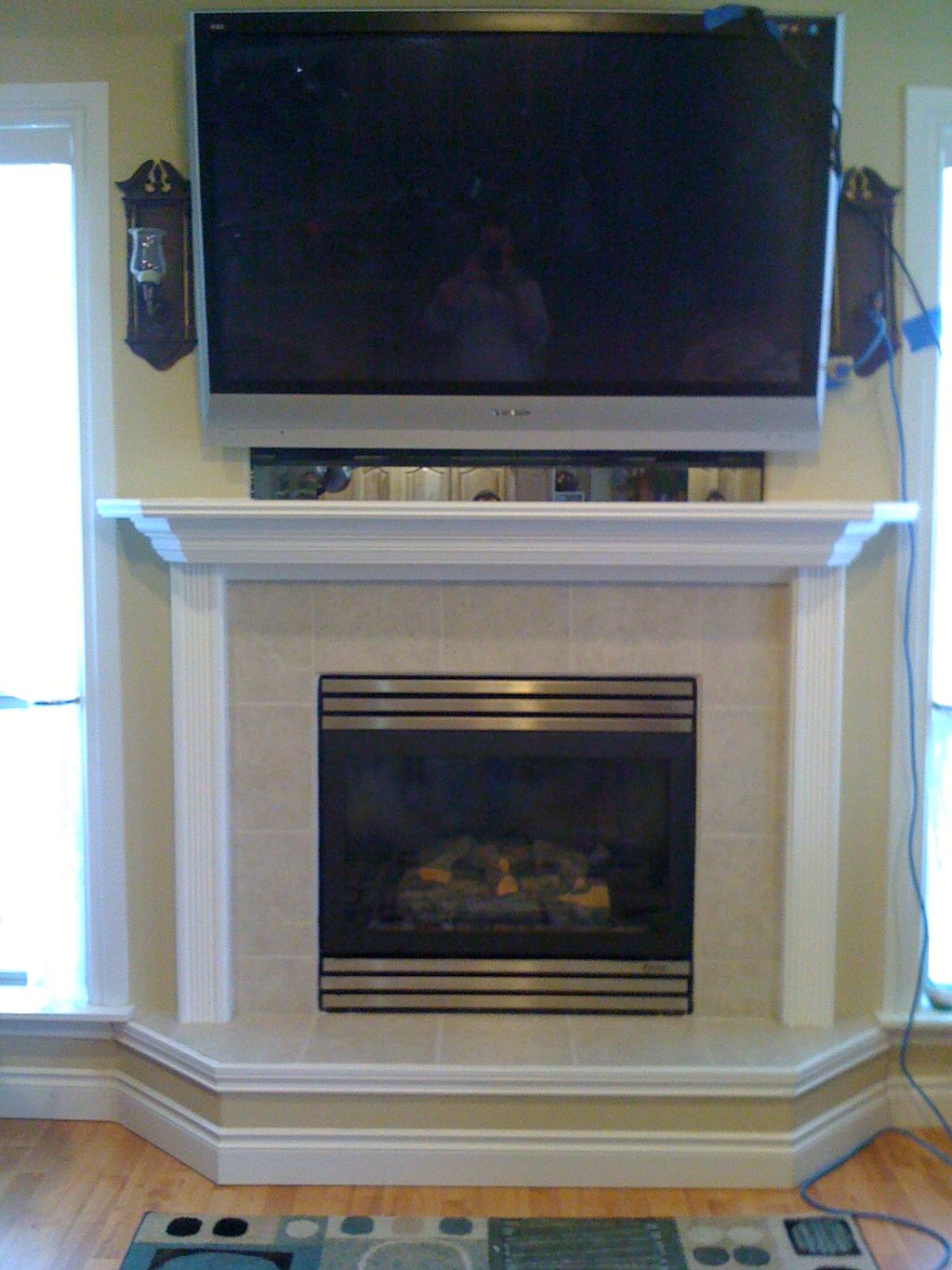 Installed new tile and a wood mantel that supporte