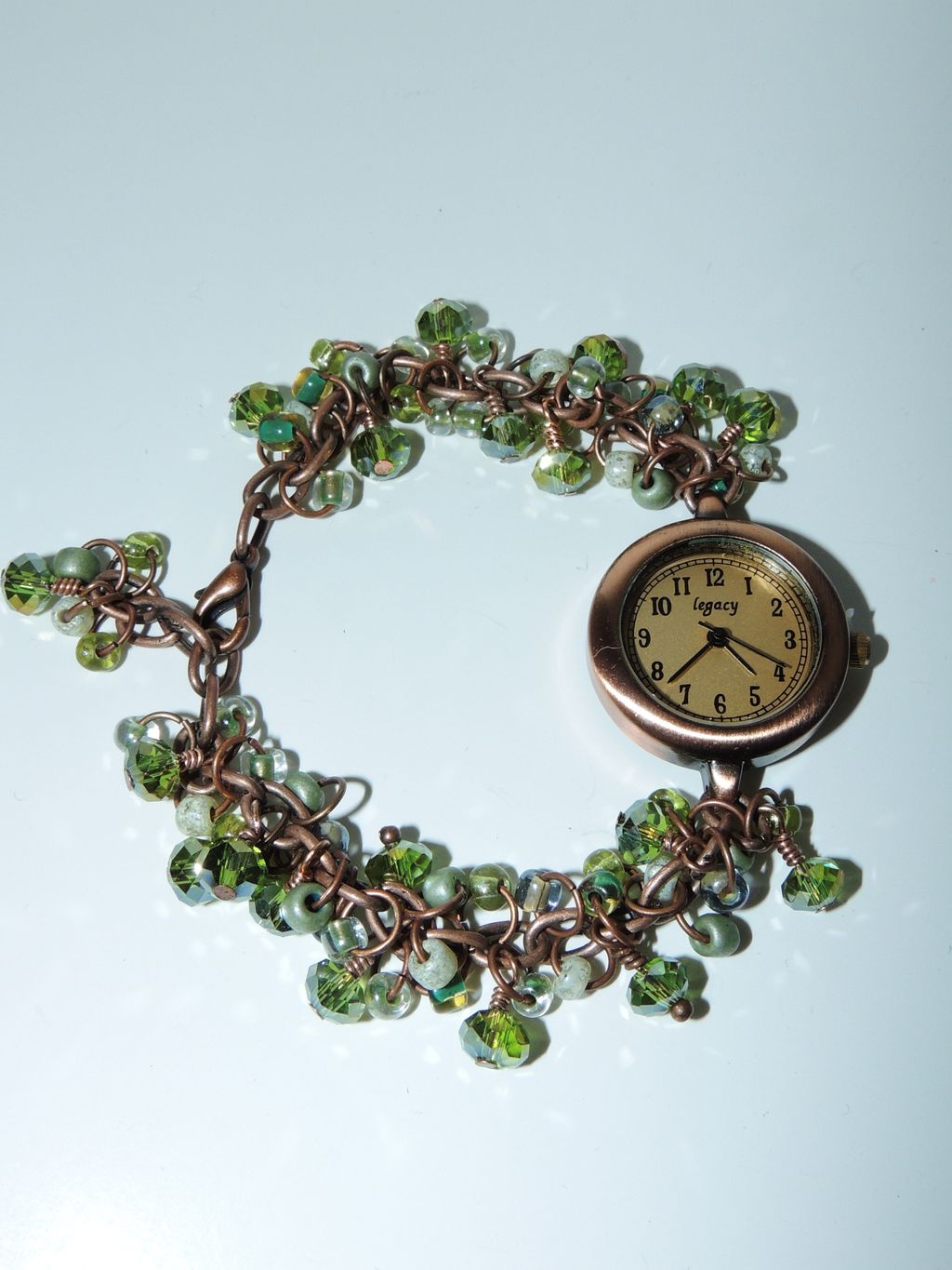 This watch is made of shades of green 6/0 glass se