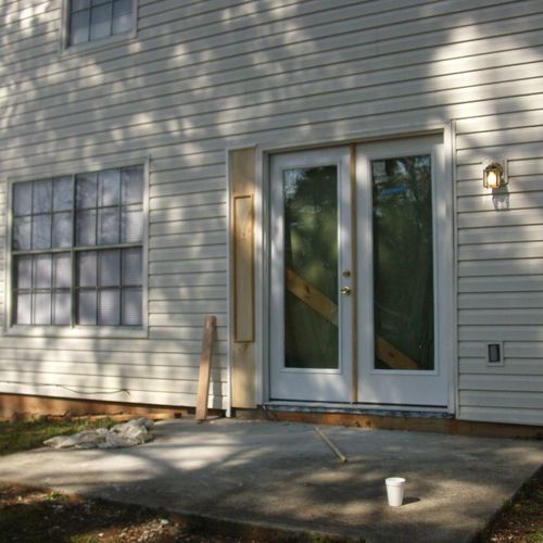 install patio door and repair damage exterior wall