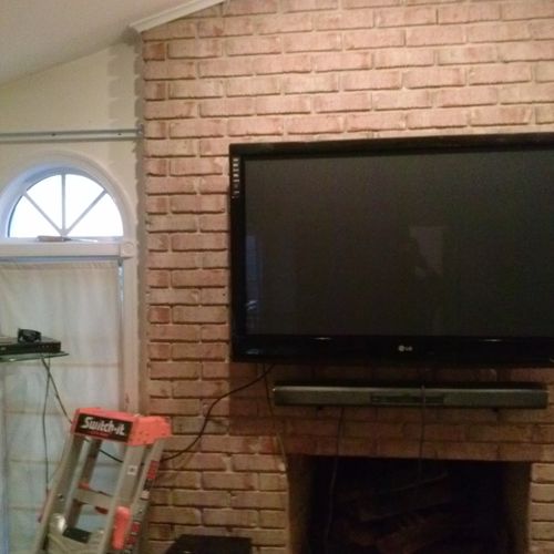 TV Mounted over a fireplace