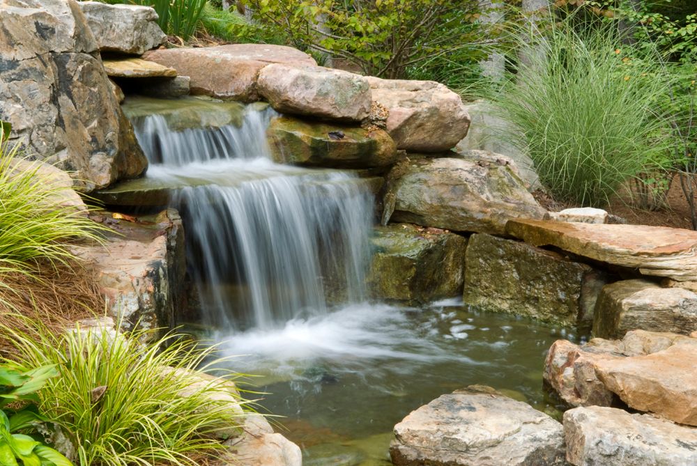 Backyard water feature viewed from patio.