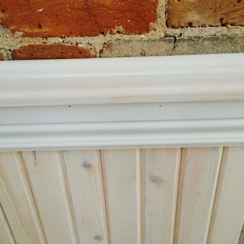 A closer view of the custom whitewashed wainscot, 