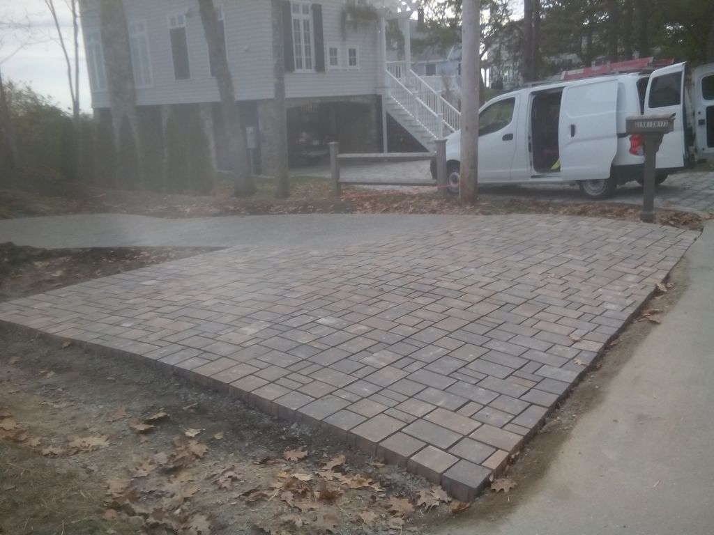 Permeable pavers installed for drainage at beginni