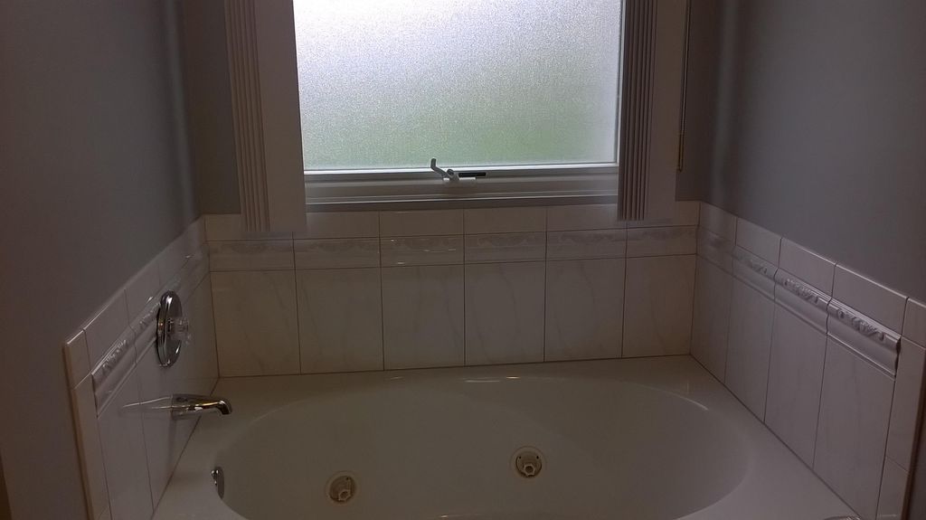 Custom tile installation in Master Bathroom