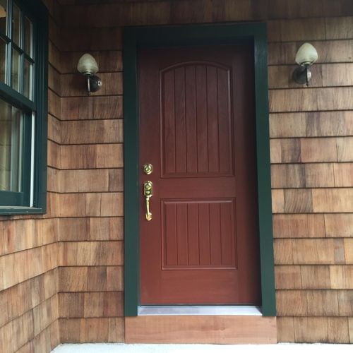 Replaced entry door complete with custom trim