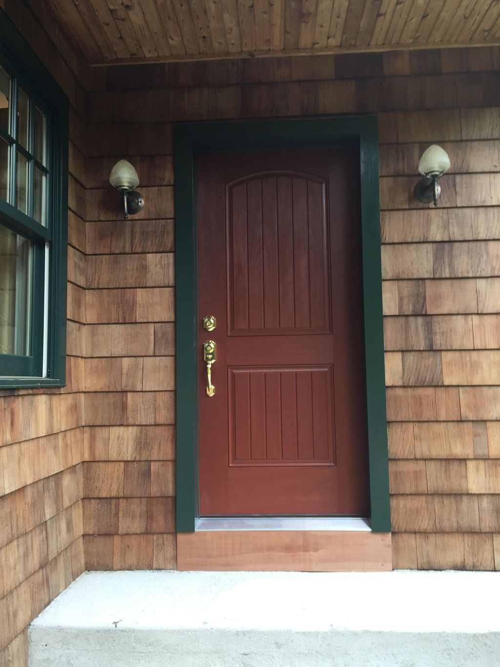 Replaced entry door complete with custom trim