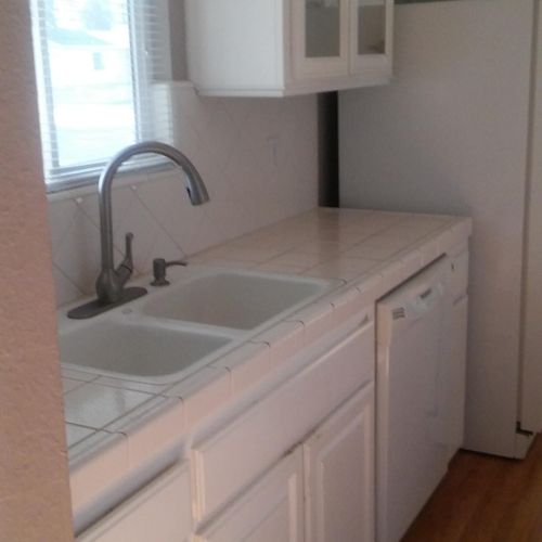 Cabinets and tile countertops, sinks and fixtures,