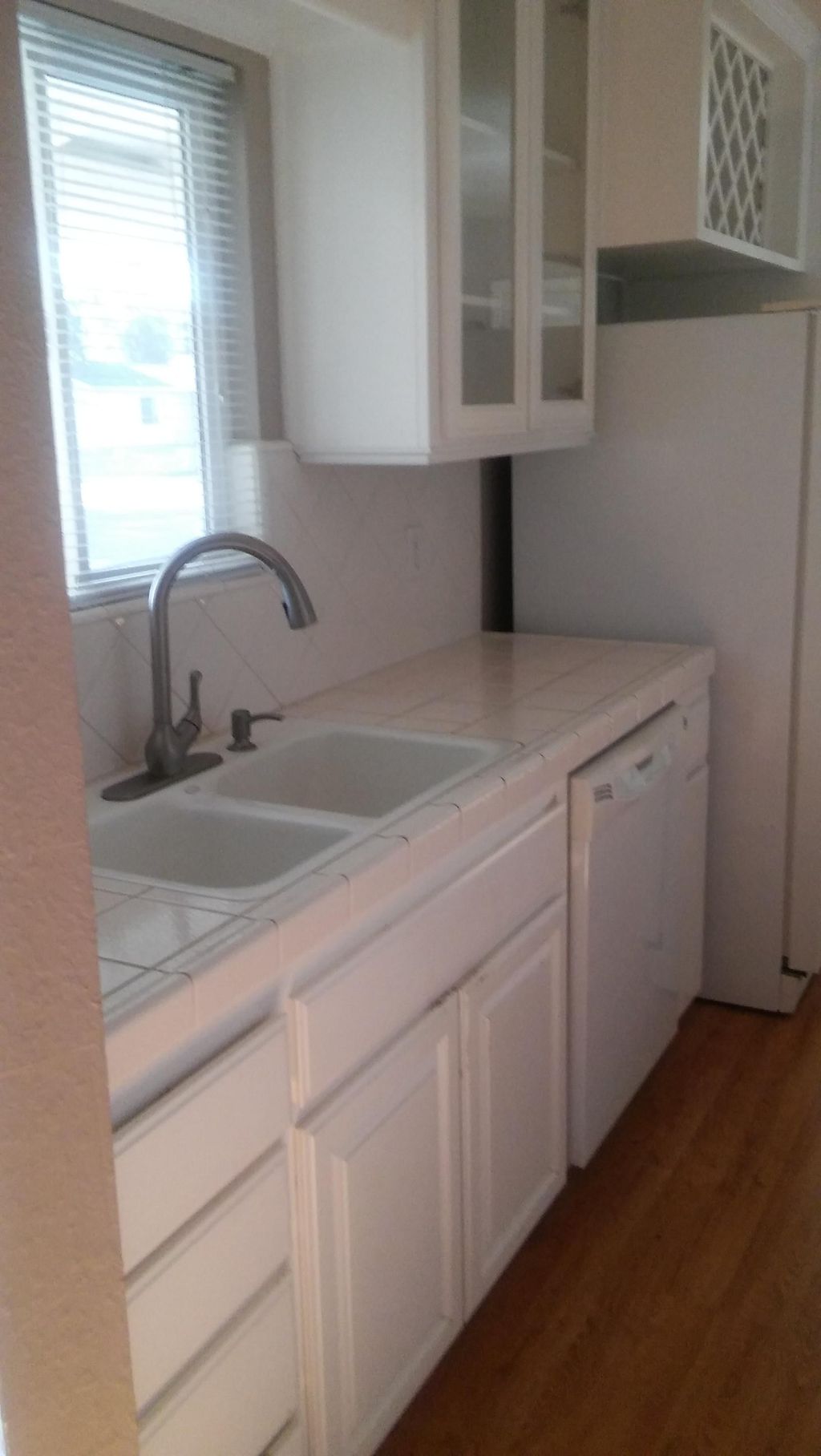 Cabinets and tile countertops, sinks and fixtures,