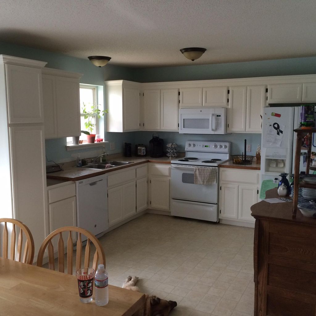 Painted cabinets, added pantry and countertops