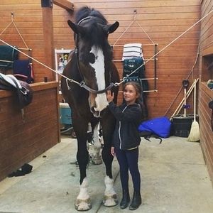 One of our smallest riders with our biggest horse!