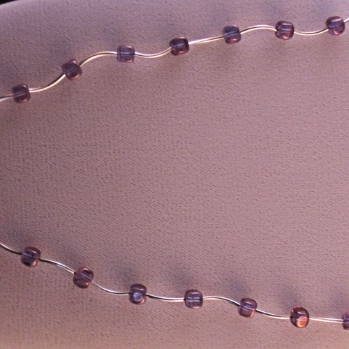 A very delicate necklace comprised of square Czech