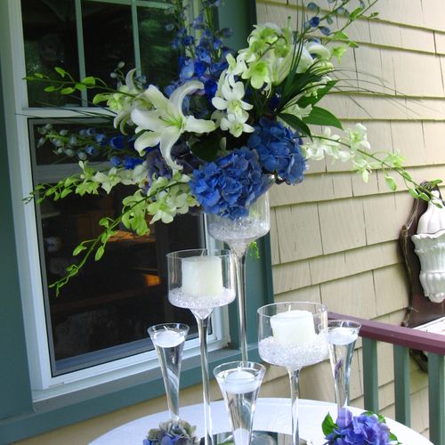blue hydrangea and white dendrobium and lily cente