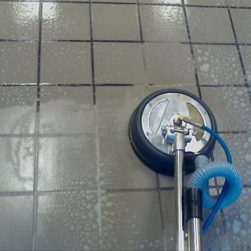 Steam with acid-based cleaner and grout brushes he