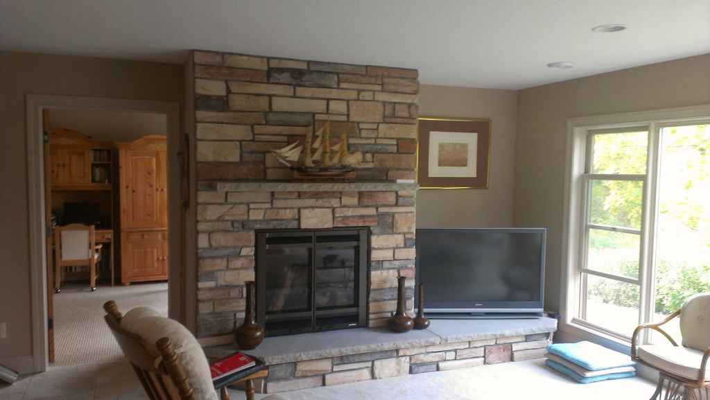 Basement remodel with stone fireplace.