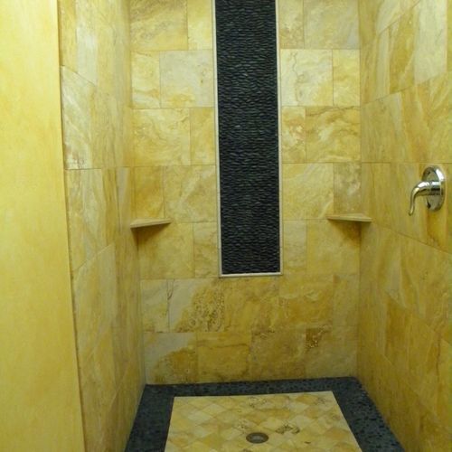 California gold travertine shower with a river roc