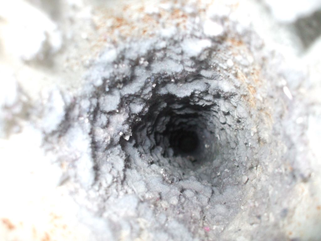 Lint accumulation in dryer vent duct.