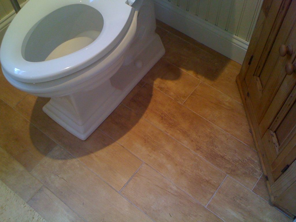 New 3. The floor is actually ceramic tile,,,not wo