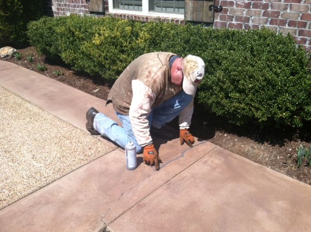 Filling cracks on the driveway.  Some parts of my 