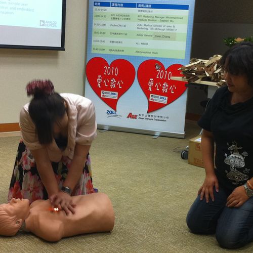 Students practice in a CPR class at Analog Devices
