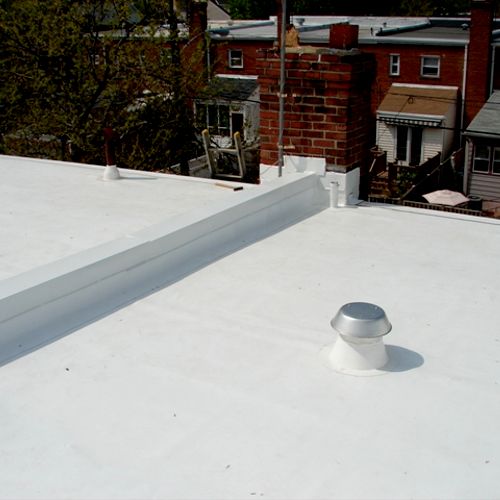 White TPO flat roof on two adjoining row houses in