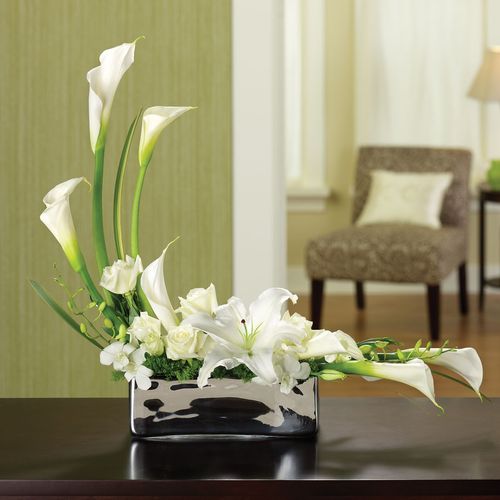 This sleek and elegant arrangement features calla 