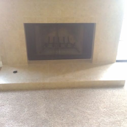 This was a red brick fireplace. We tiled over it a