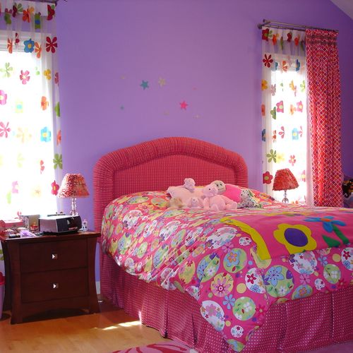 Young girl's bedroom with custom upholstered headb