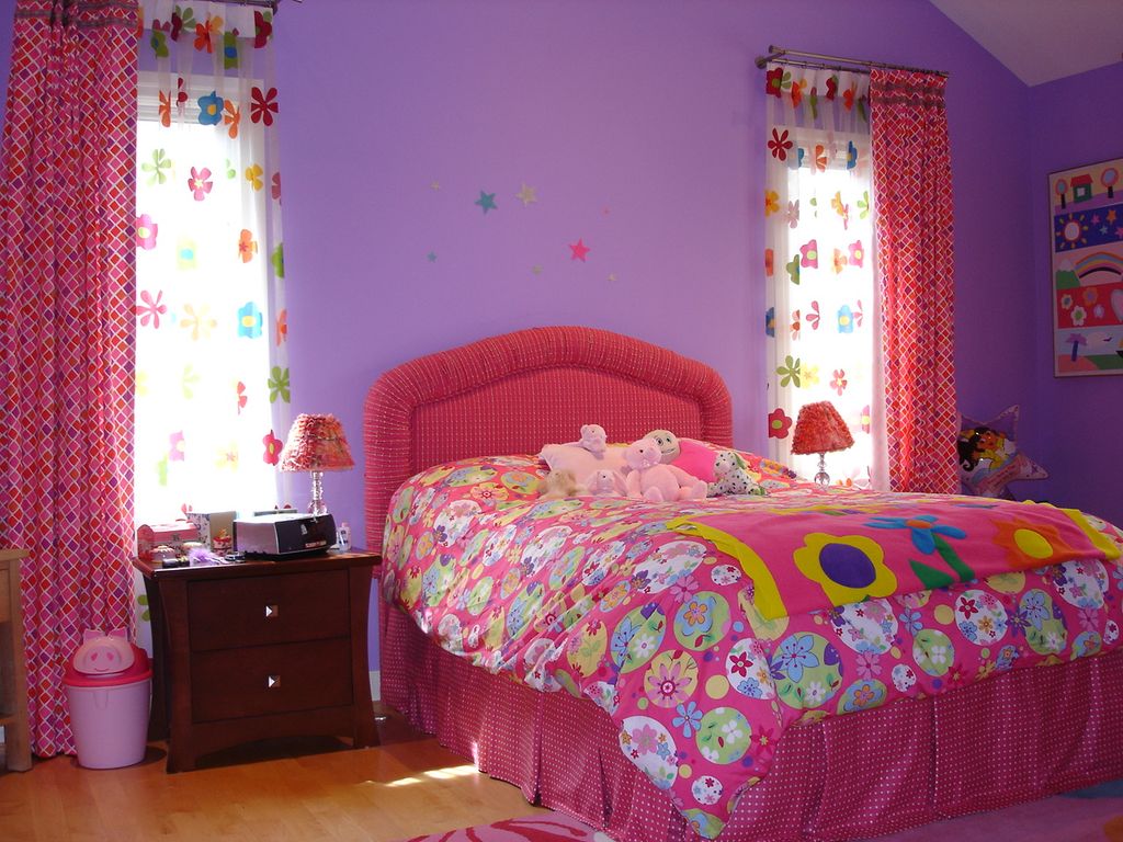 Young girl's bedroom with custom upholstered headb