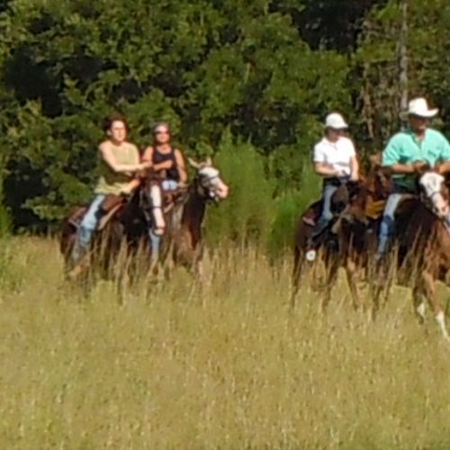 Robert cantering with a group of riders