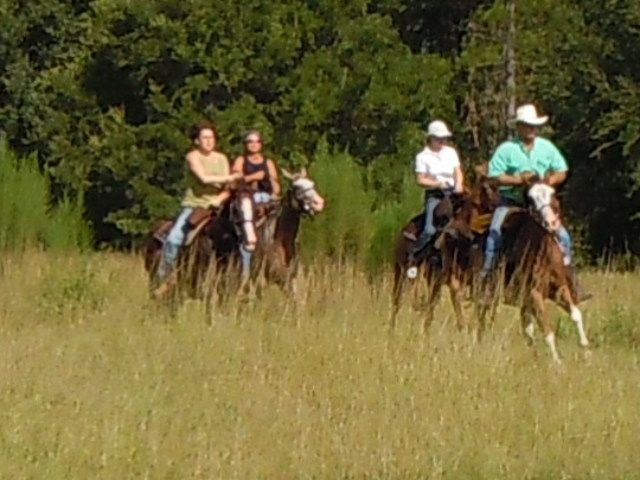 Robert cantering with a group of riders
