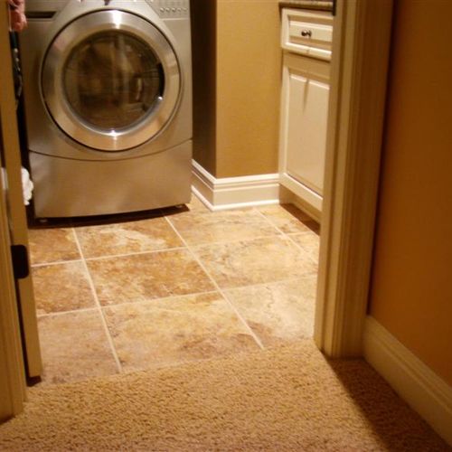 18" tile in the laundry room with frieze carpet in