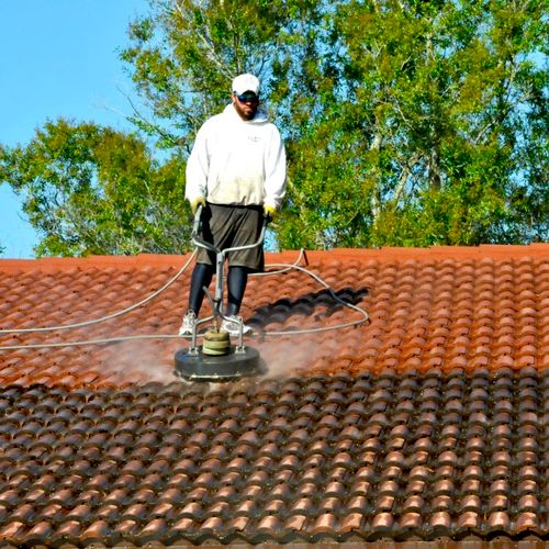 Surface cleaning a roof.