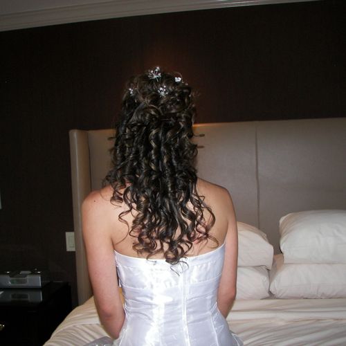 Example of a partial Up Do with curls on the bride