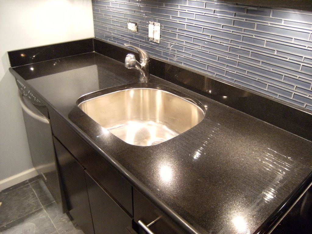 Granite  and glass mosaic backsplash