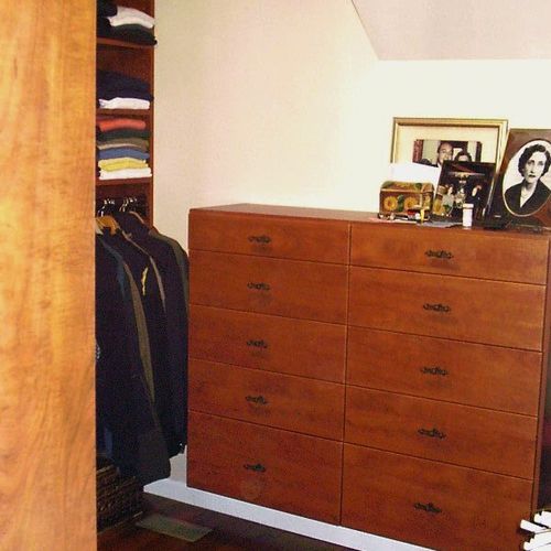A floating dresser in Cherry finish fits nicely un