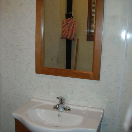 Installed vanity and mirror.