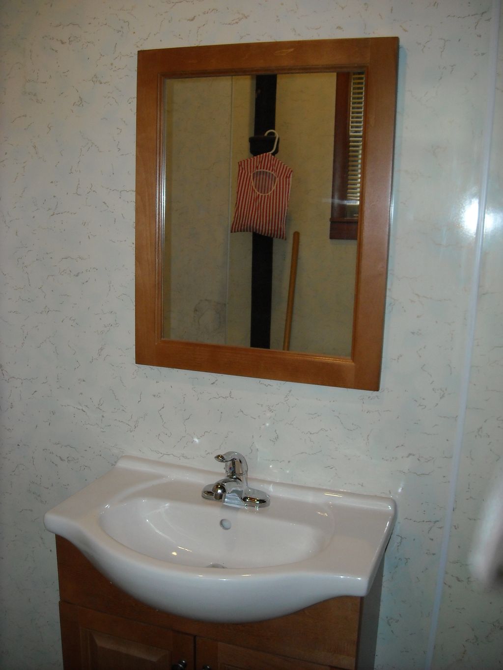Installed vanity and mirror.