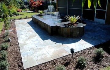 Blue flagstone patio and fountain designed and bui