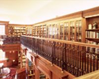 Ironwork trims the upper floor of a private librar