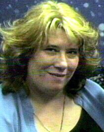 Pamela, as a blonde with short hair.