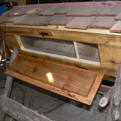 Custom top bar hive with cedar roof and whole ceda