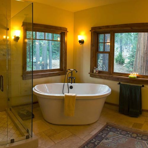 The master bath, facing forested greenbelt, provid