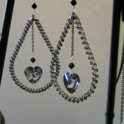 Silver and gunmetal drop earrings with a black dia