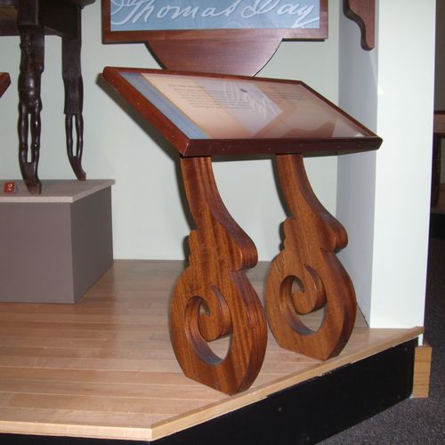 The two solid mahogany scrolls shown here are part