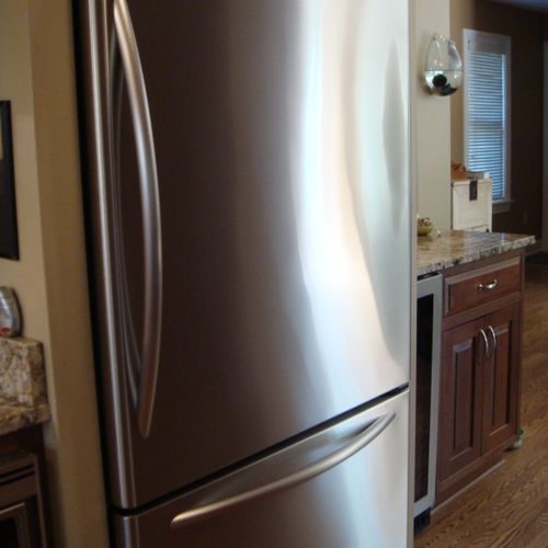 Stainless steel fridge cleaned by Greener House Cl
