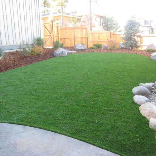 Synthetic turf for a dog area backyard.